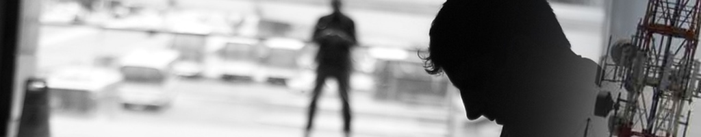 Man at airport & telecoms towers.